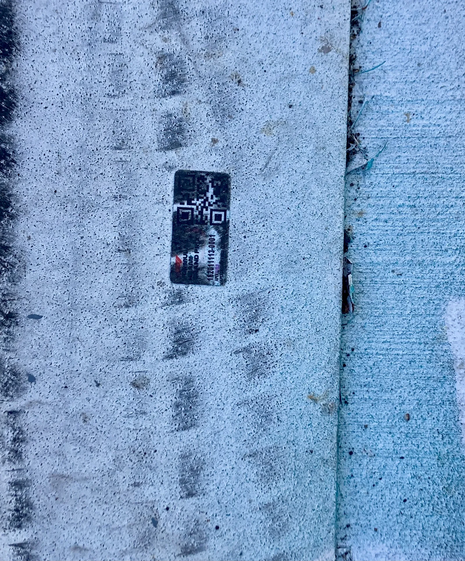 Same Strongest Level tag still readable on the F1 concrete barrier after the race